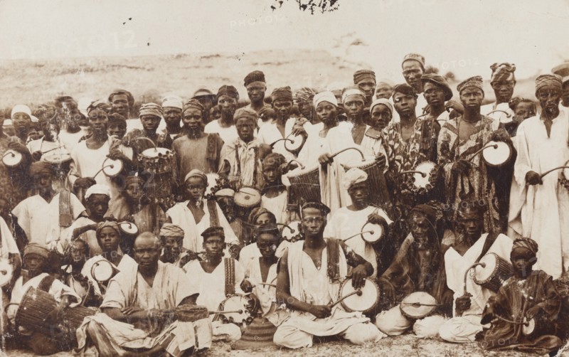 Group of dancers and tom-tom drummers posing for the camera
