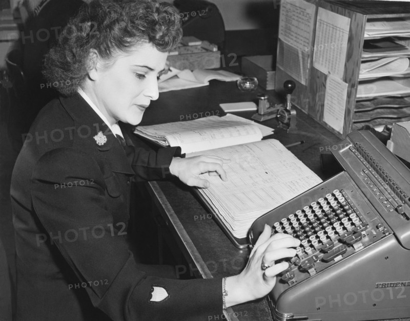Woman Using Rotary Calculator