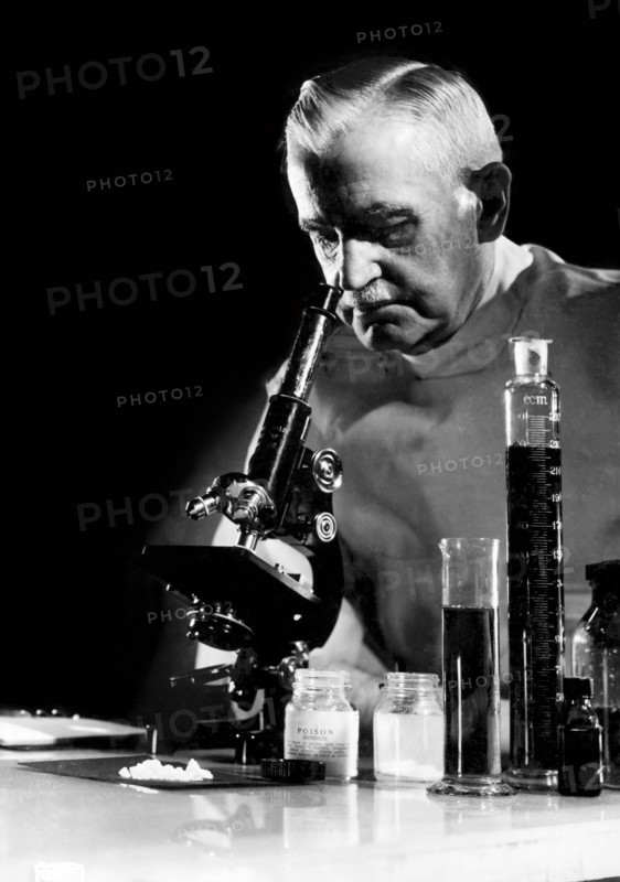 Scientist With Microscope