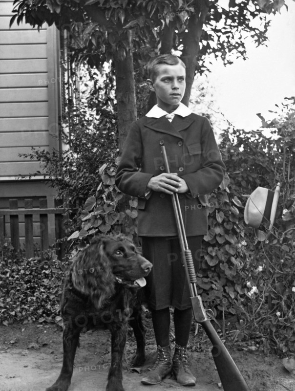 Boy With His Rifle And Dog