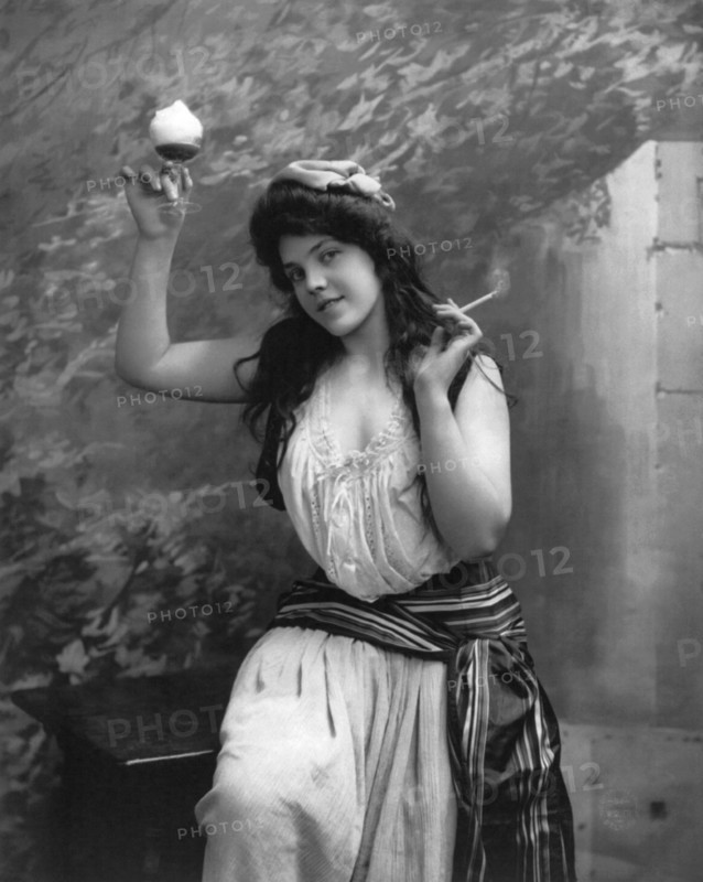 A Woman Smoking And Drinking