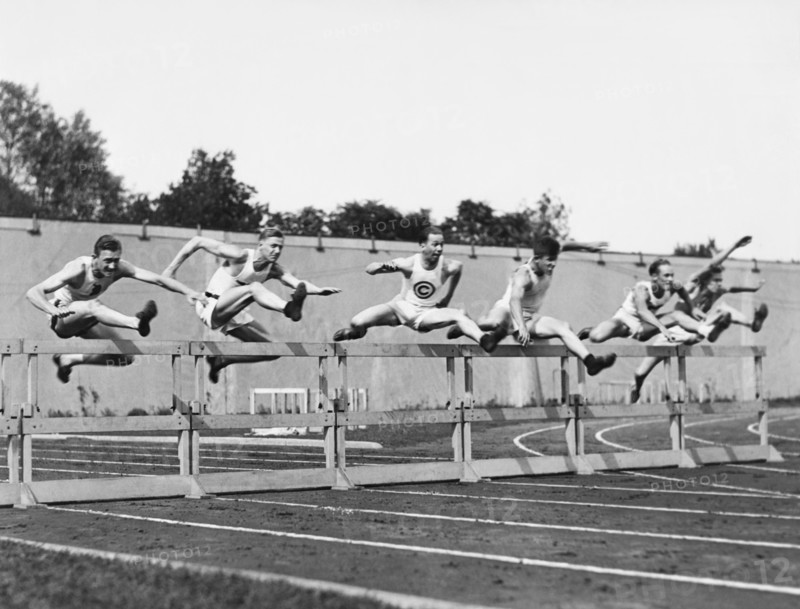 Men Running High Hurdles
