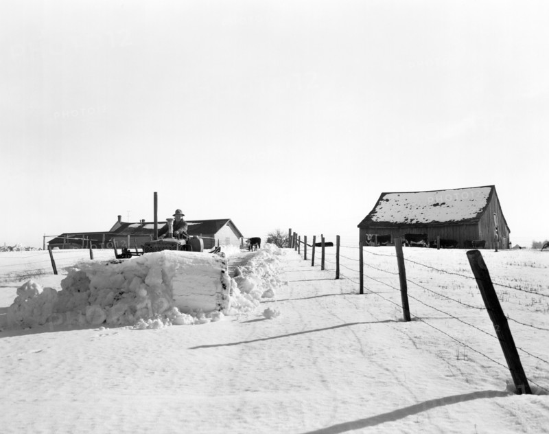 Plowing Snow With A Tractor