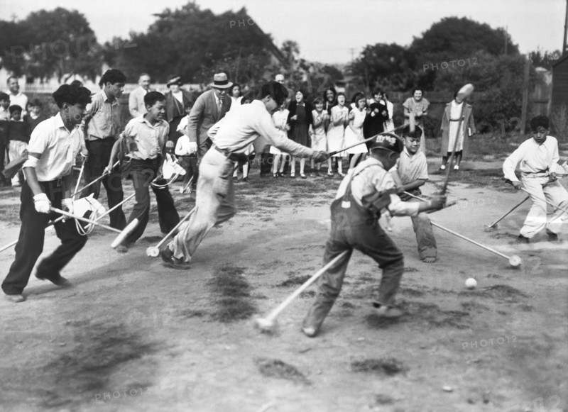 Children Play Broomstick Polo