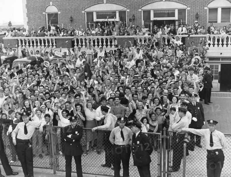 Crowd Welcomes Howard Hughes