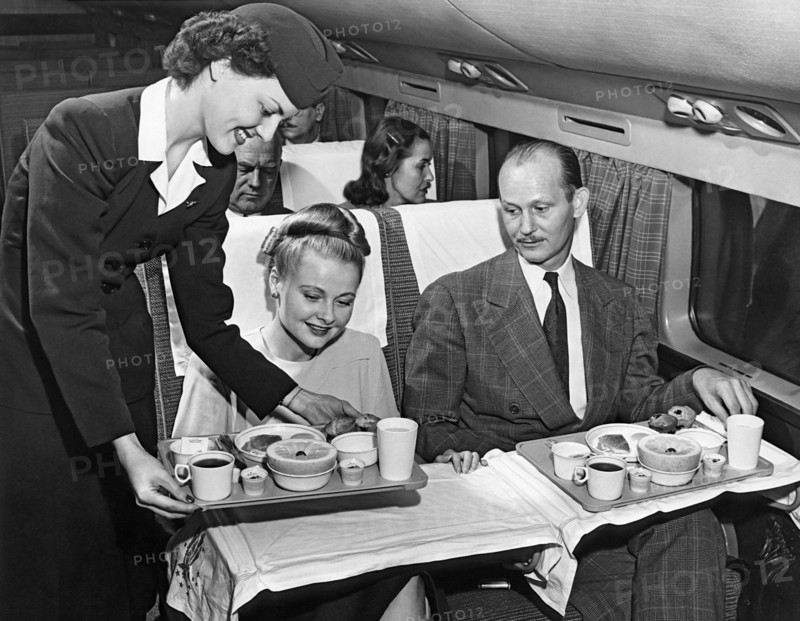 A Stewardess Serving Breakfast
