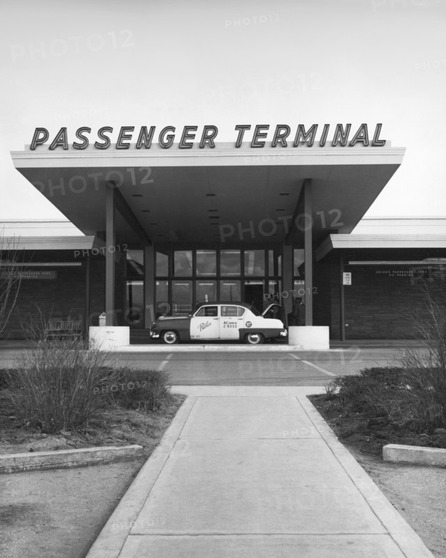 Denver, Colorado:  c. 1954
A taxi cab at the entrance to the passenger terminal at Stapleton International Airport.   © Underwood Archives / The Image Works