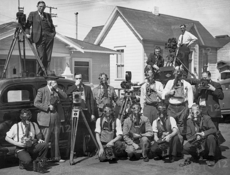 Reporters With Gas Masks