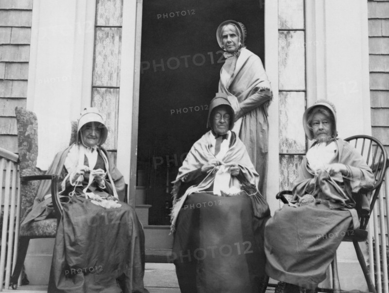 Women Knitting On A Porch