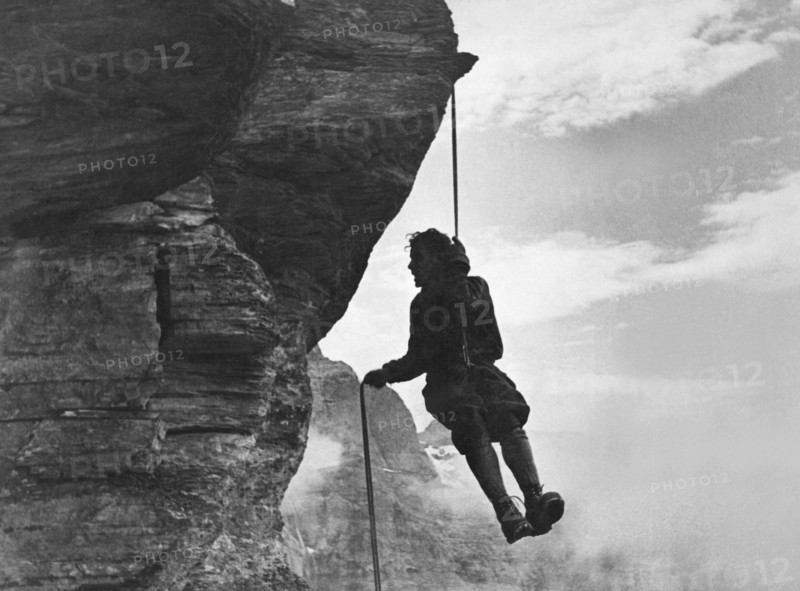 A Mountain Climber Rappelling