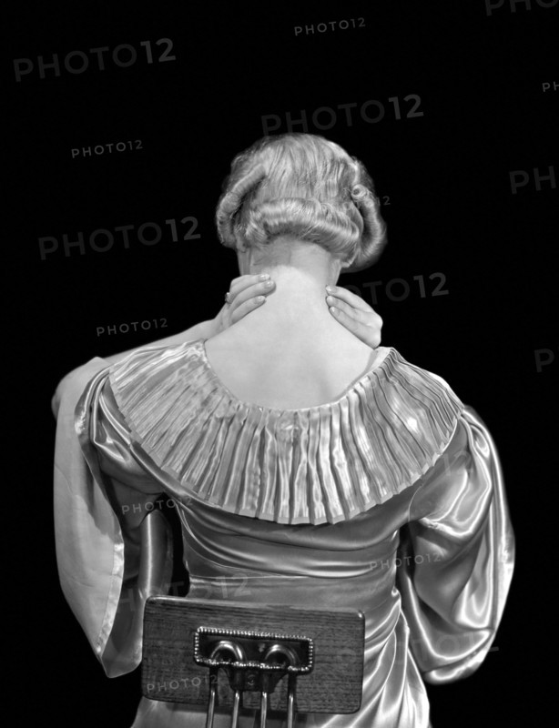 Woman Rubbing Her Neck