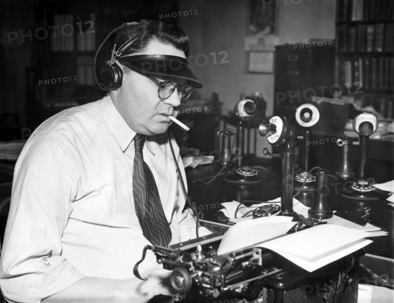 Newspaper Man At His Desk