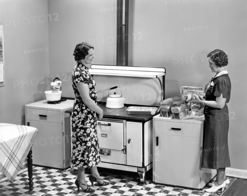 Beaver Dam, Wisconsin:  1937.
Two women admiring loaves of freshly baked bread.