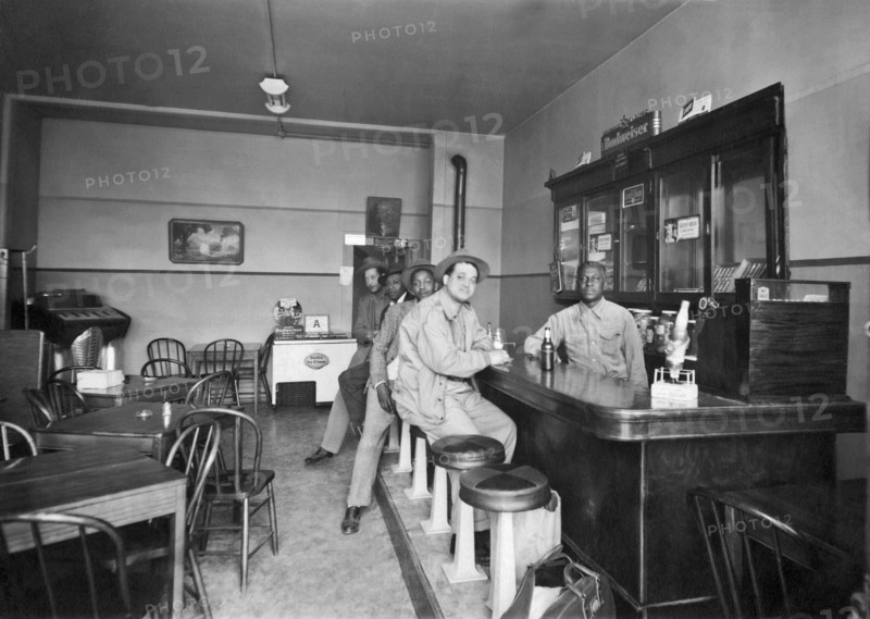 Men Sitting At A Bar