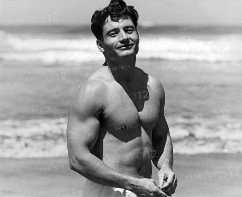 Body Builder At The Beach.