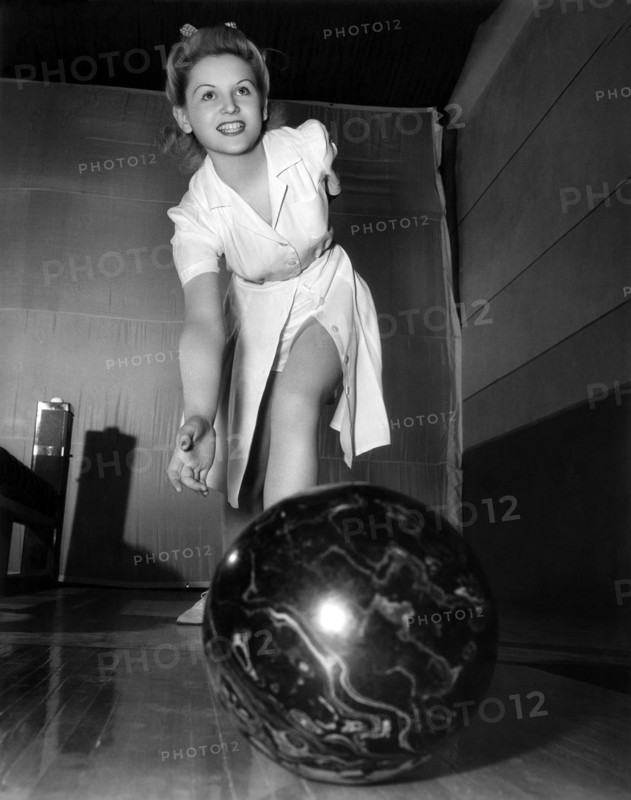A Young Woman Bowling