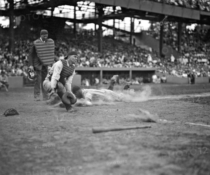 Yankees Lou Gehrig scores head first in the 4th inning