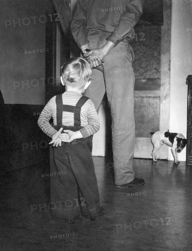 A Boy Imitates His Father