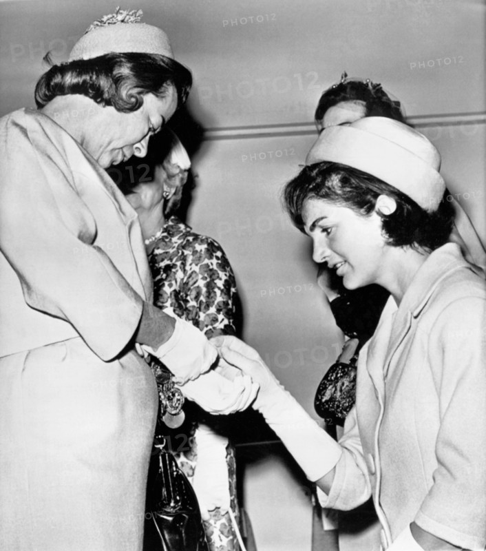 Jackie Inspects Gold Bracelet
