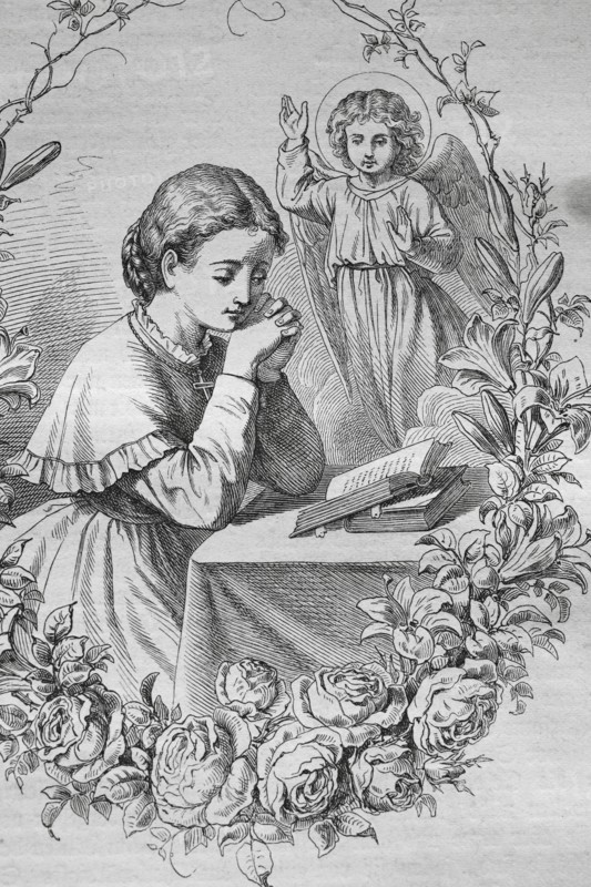 Praying child with an angel