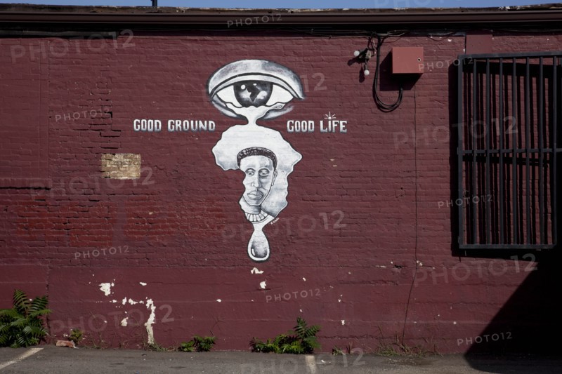 Painted image of African and African Youth on the side of a building 2010