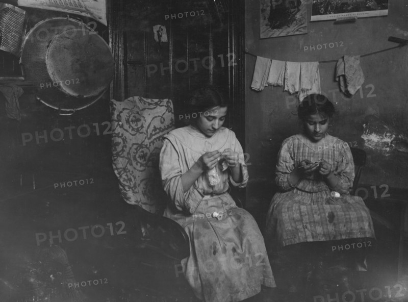 Katie (13 years) and Angeline Avella (11 years),  making cuffs, Irish lace.  1912
