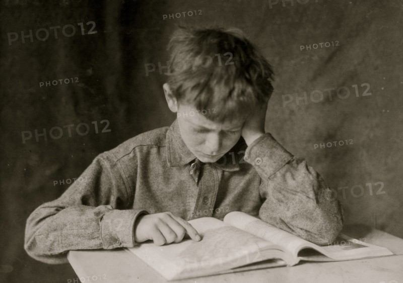 A Boy Reads a Book and Studies 1924