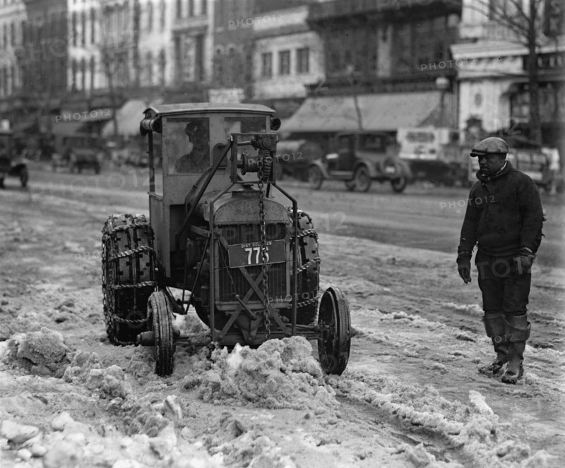 A Ford Tractor cleans snow on DC Street 1924