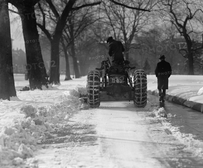 A Ford Tractor cleans snow on DC Street 1924