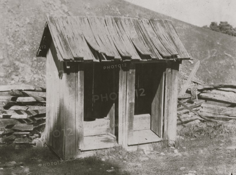 A poor toilet, of the old style at Buzzard School. These will be replaced later by concrete toilets. 1921