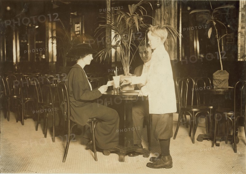 A young table boy in Newsome's ice cream parlor. 1914