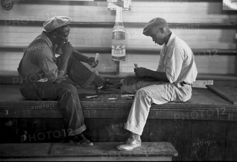 African American Playing cards on a bench 1938
