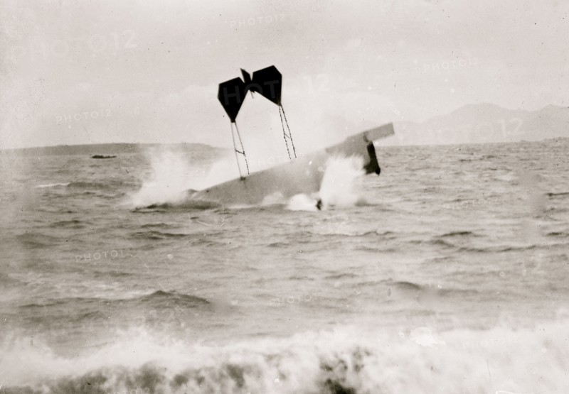 airplane of pilot and daredevil Hugh Armstrong Robinson (1881-1963) making a crash landing on water near Nice, France, 1912. 1912