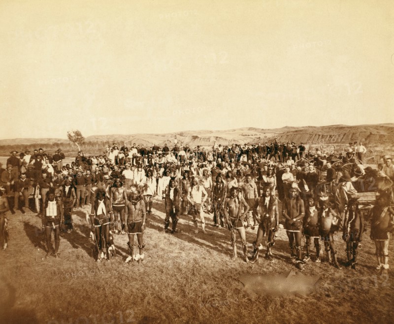 At the Dance. Part of the 8th U.S. Cavalry and 3rd Infantry at the great Indian Grass Dance on Reservation 1890