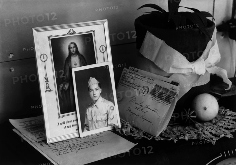 Pictures and mementoes on phonograph top: Yonemitsu home 1943