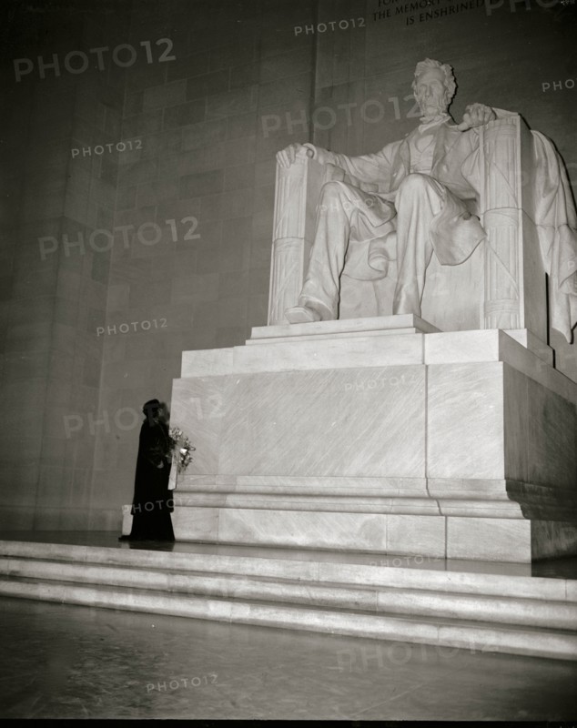 Marion Anderson before a statute of President Lincoln in the Memorial in DC 1939