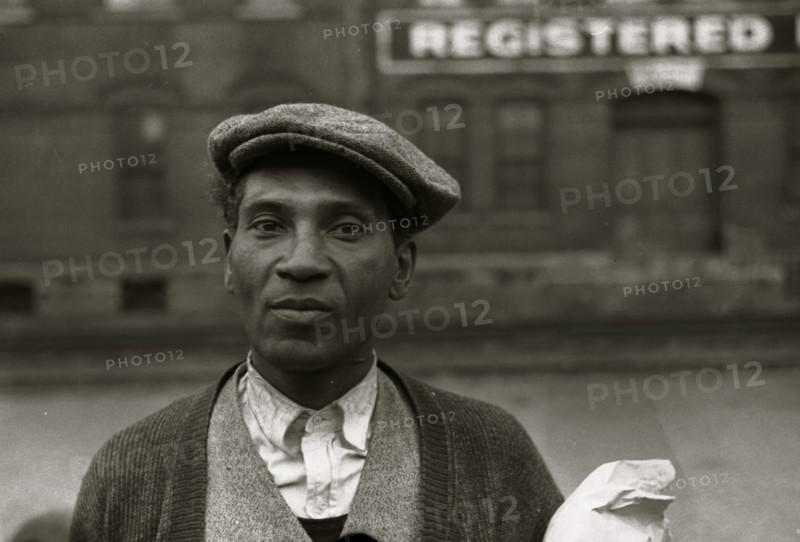 Black waiting for freight train to leave Dubuque, Iowa 1940