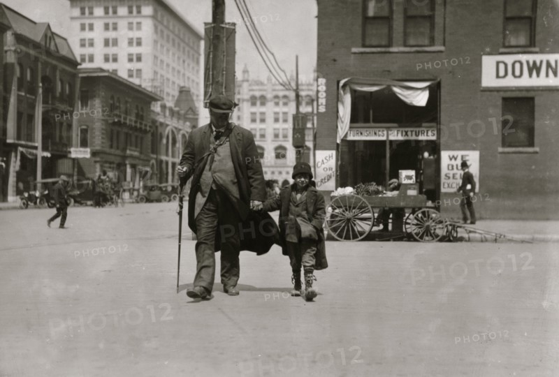Blind man and his youthful guide 1917