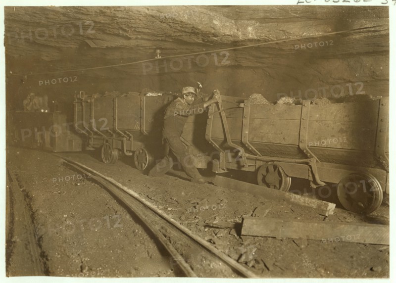 Boy braking on motor train 10 hrs. a day.  1908