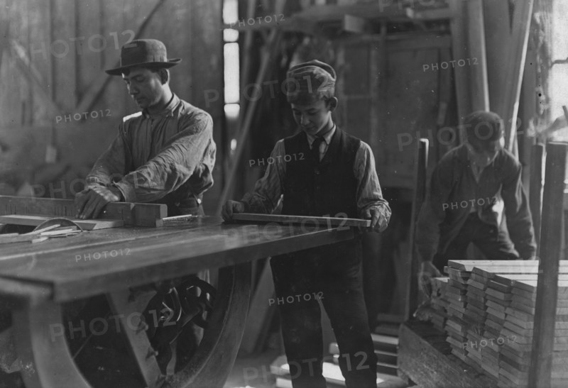 Boys taking away from saws and brading. Schultze, Waltman & Co. Planing Mill  1908