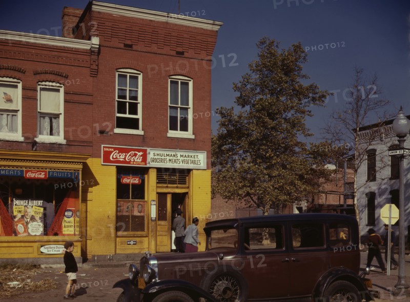 Car in front of Shulman's Market on N at Union St. S.W., Washington, D.C. 1941