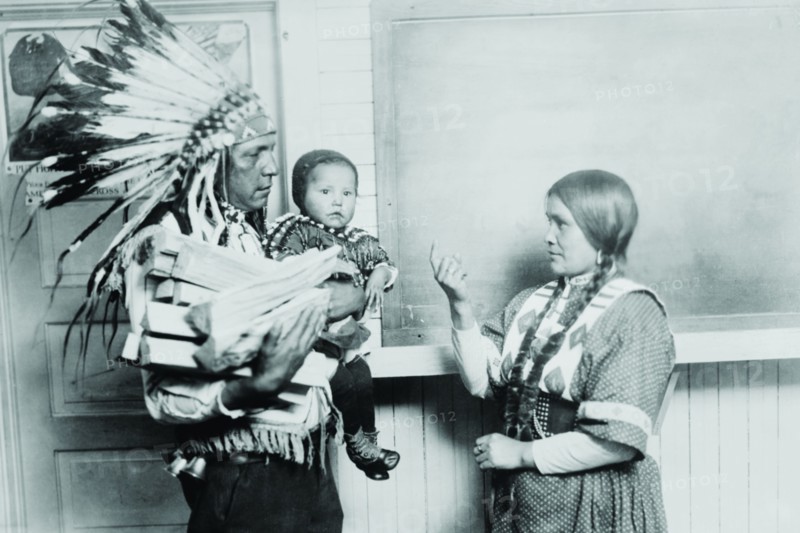 Chief Fish Wolf Robe in Native Dress and War bonnet, his child and wife