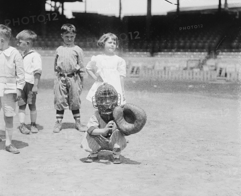 Pint sized Catcher awaits a pitch in Children's Baseball Game 1921