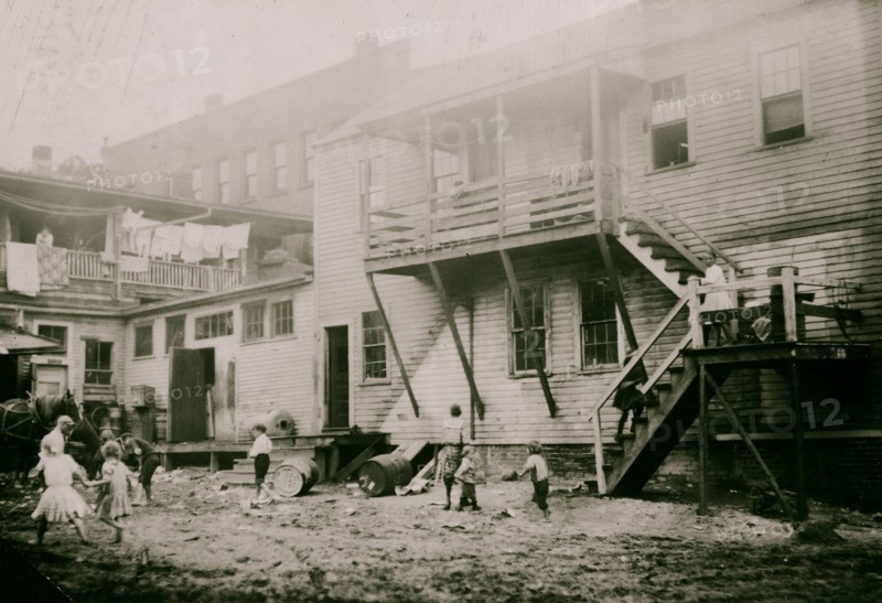 Cottage Street hovels down by the river in Easthampton, Mass., in which a great deal of home work is done on suspenders 1912