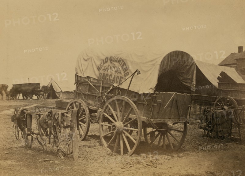 Covered wagon for "Headquarters baggage" and saddlery, probably a Civil War military camp 1863