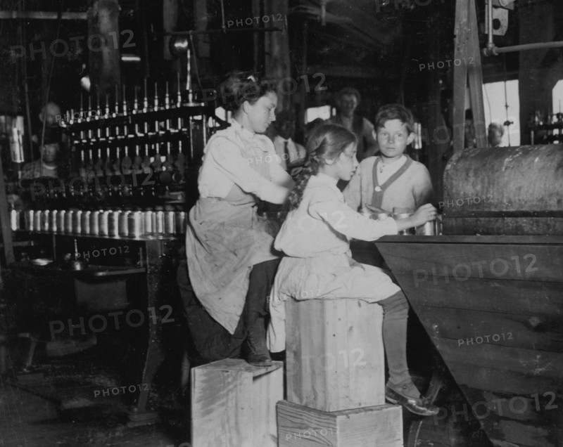 8 year old works in Ross' canneries. She helps at the capping machine, but is not able to "keep up." 1911