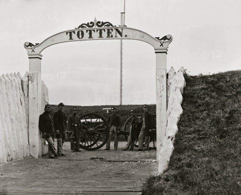 District of Columbia. Men and gun of 3d Massachusetts Heavy Artillery at ornamental gate of Fort Totten 1865