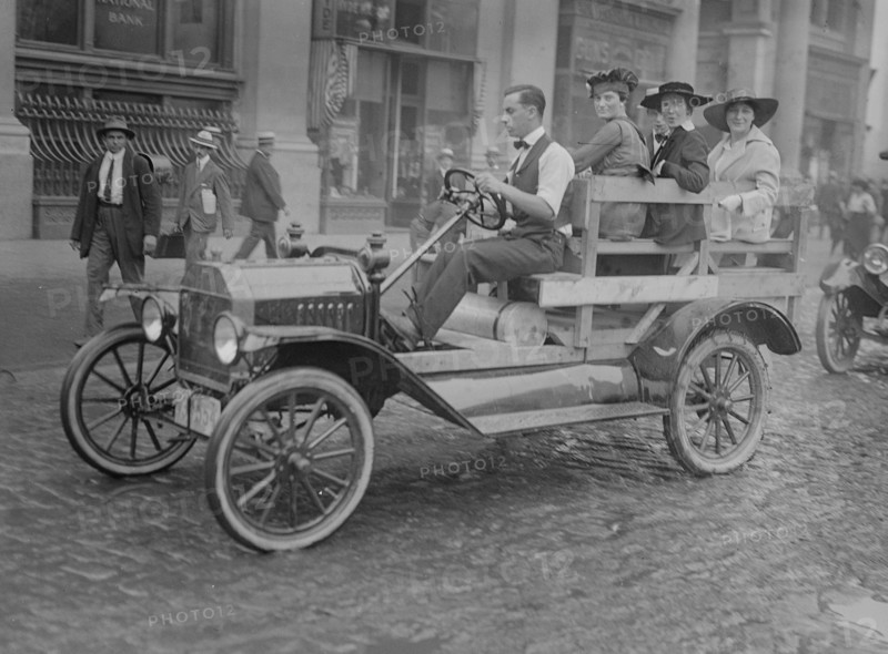 New York Car Strike has women transported to work in an open sided male driven vehicle 1916