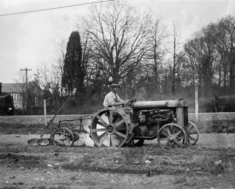 Ford Tractor plowing field 1925