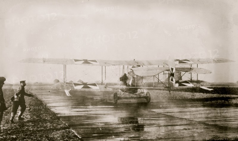 German Military Aviators in their planes on the tarmac